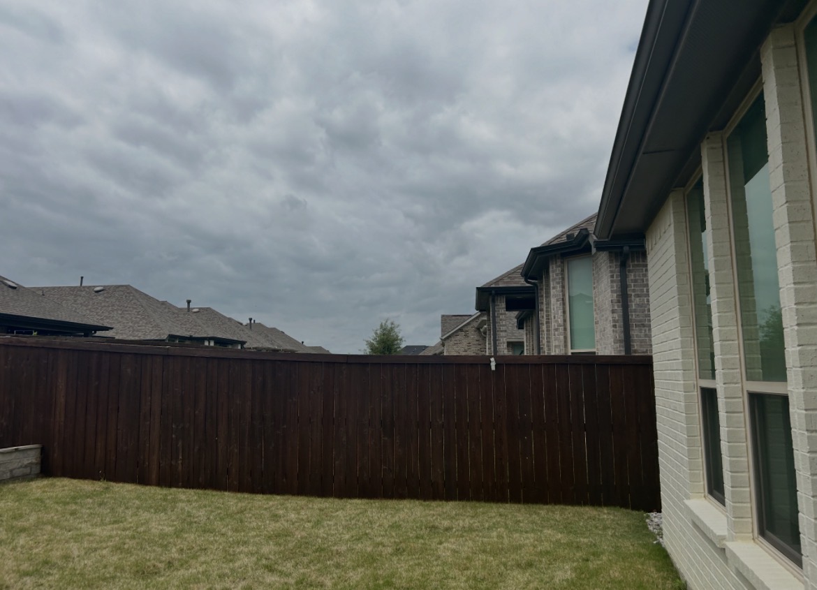Dark stained cedar fence
